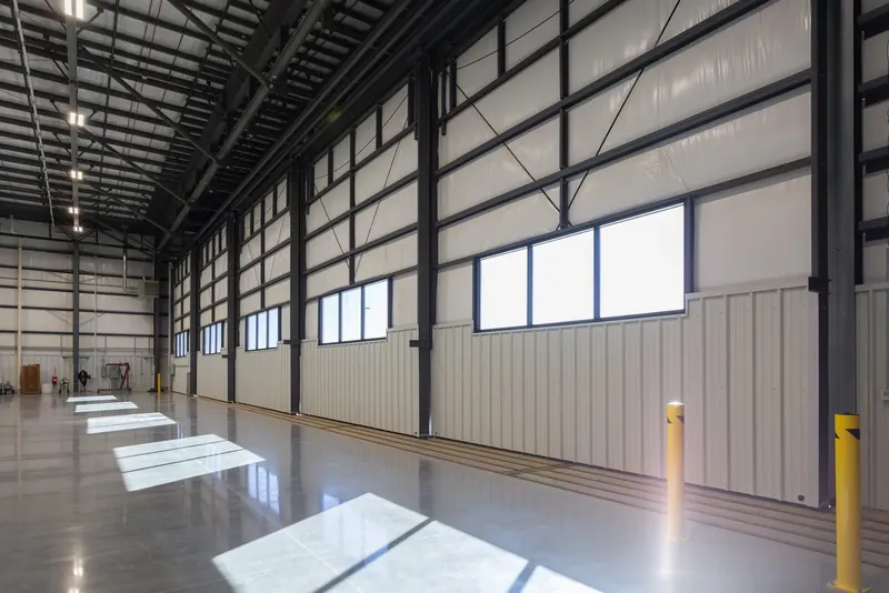 Clear-span interior of the new Causey Aviation hangar at KGSO