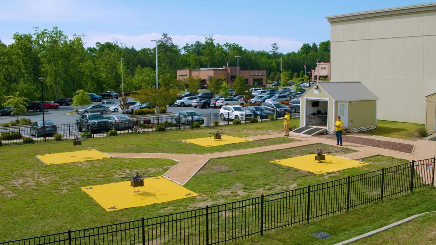 Causey Aviation Unmanned delivery drones on launch pads with operators at a North Carolina delivery site