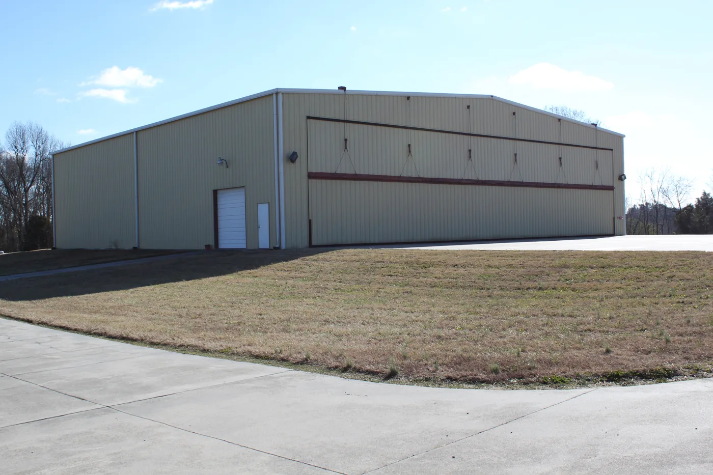 Hangar and apron at Causey Airport (NC74), a private airfield in Liberty, North Carolina